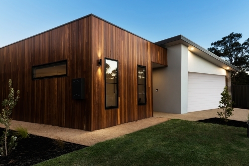 Contemporary new home facade at night dusk