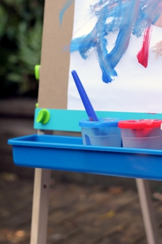 Corner of paint easel tray with pots - Australian Stock Image