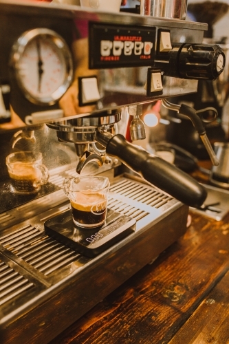 Coupe of double shot of coffee on machine - Australian Stock Image