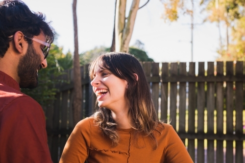couple at home in their yard - Australian Stock Image