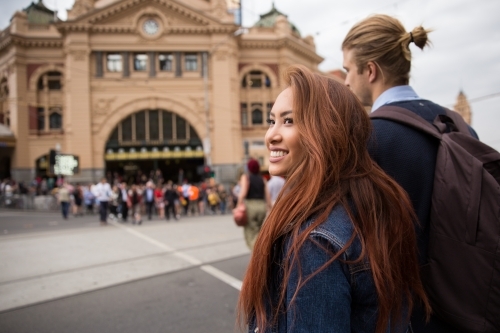Couple Crossing the Road to Flinders Street Station - Australian Stock Image