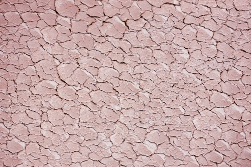 cracks in surface of dry lake bed - Australian Stock Image