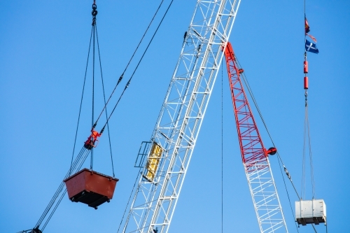 Cranes operating with materials in the Brisbane CBD - Australian Stock Image