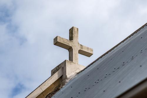 Cross on top of a country church