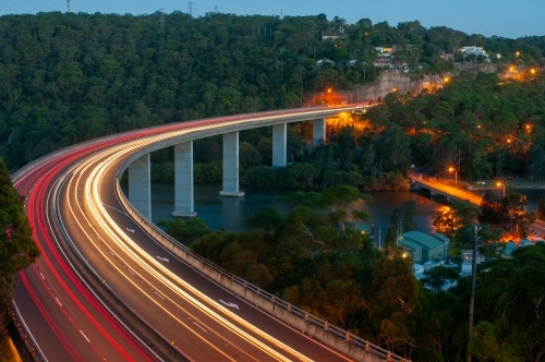 Curved bridge with car lights in a long exposure - Australian Stock Image