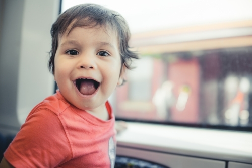 Cute 2 year old boy travels on a Sydney train - Australian Stock Image