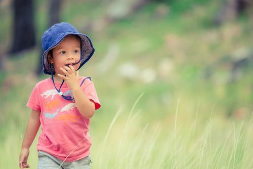 Cute mixed race little boy bushwalking on the Warrumbungles National Park Nature Trail - Australian Stock Image
