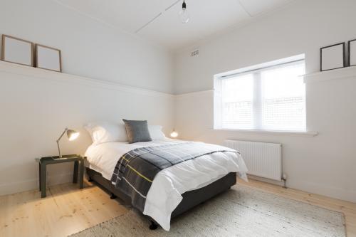 Danish contemporary styled guest bedroom in luxury renovated modern Australian apartment - Australian Stock Image