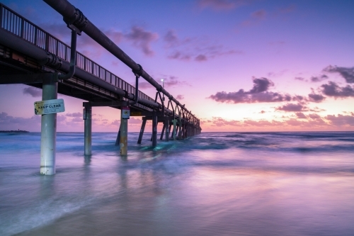 Dawn at the Spit, Gold Coast looking out to the pier with long exposure. - Australian Stock Image