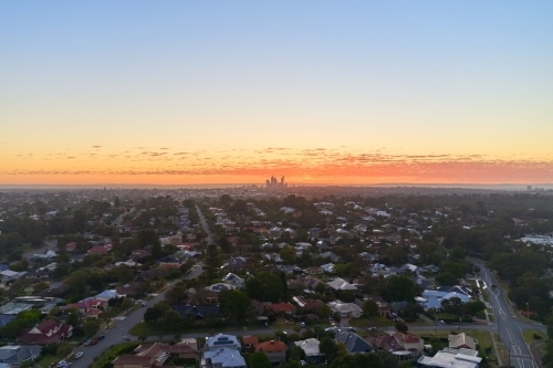 Dawn view in Perth, Western Australia, with the CBD skyline silhouetted on the horizon