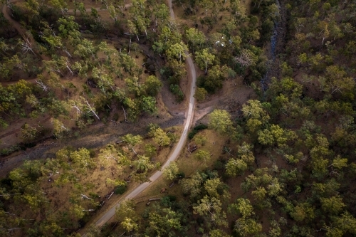 Dirt road through forest and over a creek - Australian Stock Image