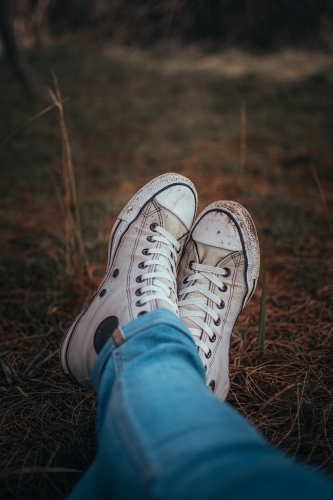 Dirty Shoes - Sitting in a bed of pine needles. - Australian Stock Image