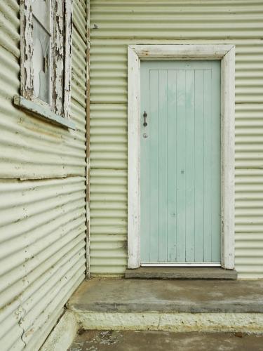 Door and broken window on old church - Australian Stock Image