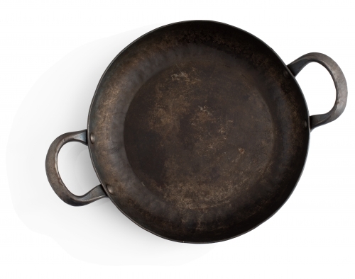 double handled rustic cast iron skillet - Australian Stock Image