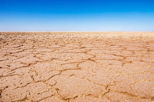 dry lake bed and blue sky - Australian Stock Image