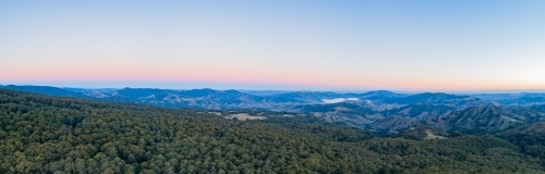 Dusk light over hills with view towards Lake St Clair in the Hunter Valley - Australian Stock Image