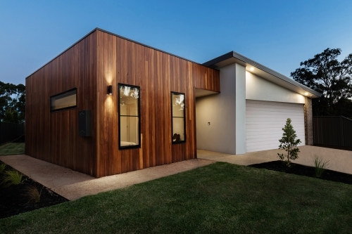 Dusk shot of a modern home with external lighting - Australian Stock Image