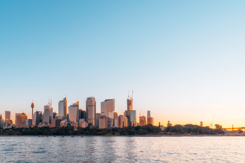dusk Sydney city skyline at sunset viewed from Royal Botanic Garden. - Australian Stock Image
