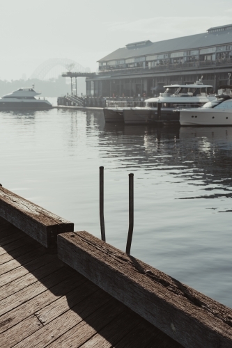 Early morning sun haze over the water at Pirrama Park/Jones Bay Wharf, Sydney NSW. June 2019 - Australian Stock Image