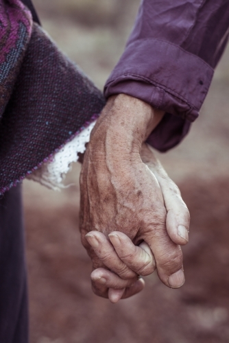 Elderly couple holding hands - Australian Stock Image