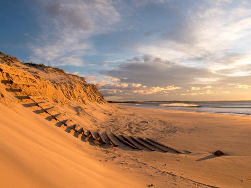 Erosion of beach sand dunes caused by a big storm - Australian Stock Image