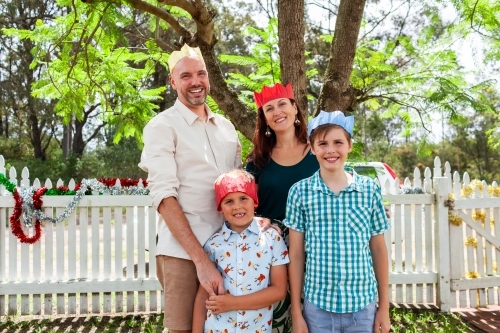 Family portrait under jacaranda tree at Christmas time    - Australian Stock Image