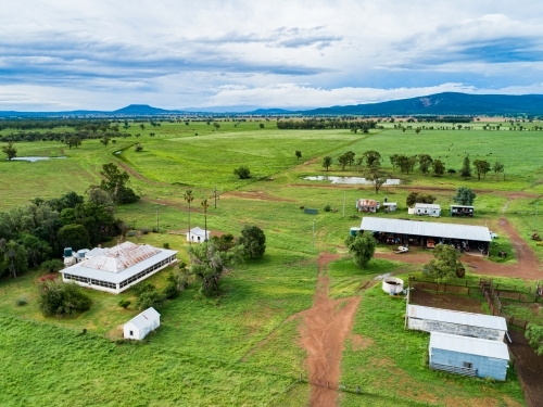 Farm buildings and stockyard seen from above on overcast day - Australian Stock Image