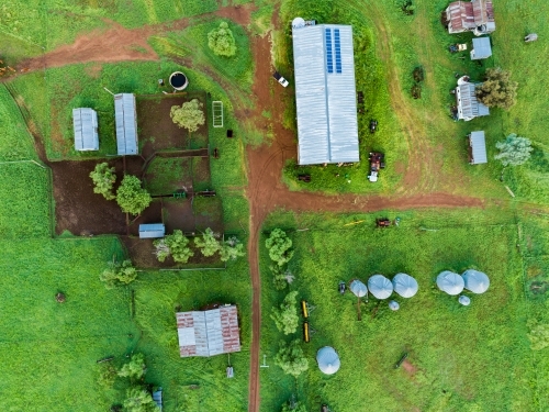 Farm buildings and stockyard seen from above on overcast day - Australian Stock Image