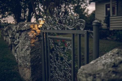 Farm house iron gate in the evening - Australian Stock Image