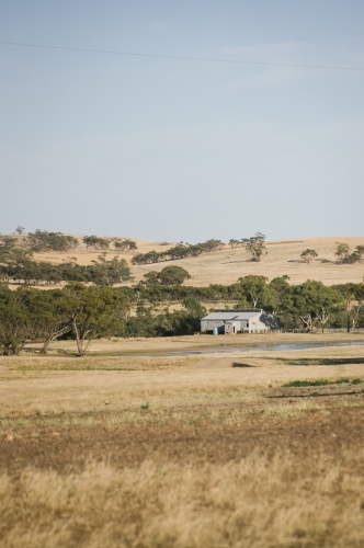 Farm sheds and landscape in Summer in the Avon Valley of Western Australia - Australian Stock Image