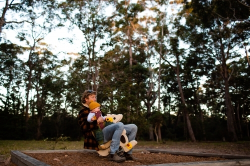 Father and baby at park - Australian Stock Image