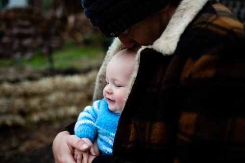 Father and baby on winter day - Australian Stock Image