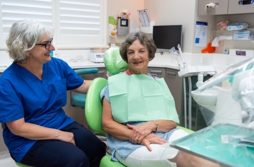 Female dentist with elderly female patient - Australian Stock Image