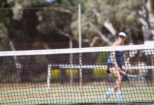 Female tennis player running for the ball - Australian Stock Image