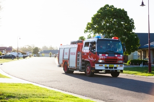 Fire rescue truck in suburban area of town at Christmas time - Australian Stock Image