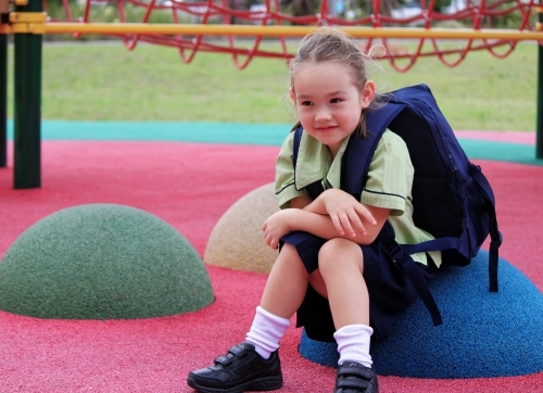 First day of school for a young girl of mixed race - Australian Stock Image