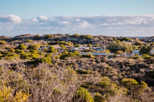 Fishing shacks community in the bush on the coast - Australian Stock Image