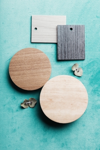 Flatlay arrangement of interiors finishes on green velvet background - Australian Stock Image