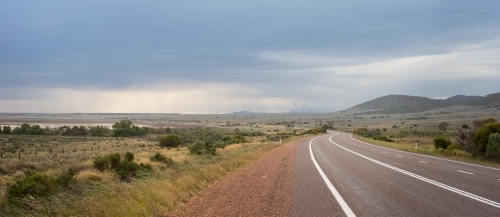 Flinders Ranges road with stormy sky - Australian Stock Image