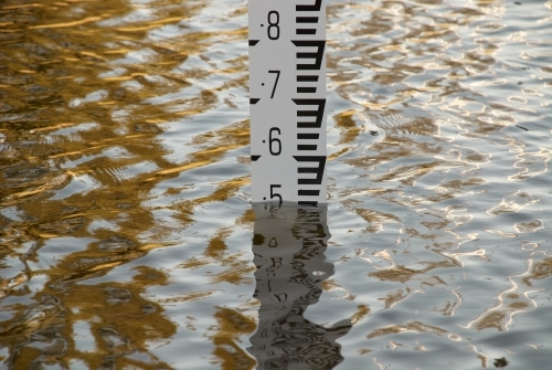 Flood depth gauge in deep water in a frequently flooding area. - Australian Stock Image