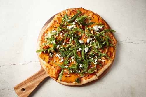 pizza on table - Australian Stock Image