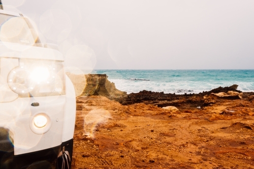 Front light of a four wheel drive car and the rocks near the sea - Australian Stock Image