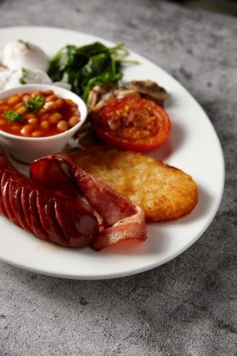 Full breakfast meal served on a white plate - Australian Stock Image