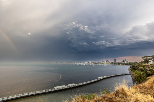 GEELONG, AUSTRALIA - FEBRUARY 02: An intense summer weather system with rainbow - Australian Stock Image