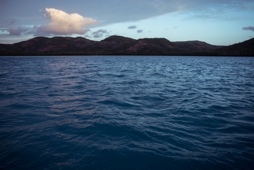 Gentle ripples and waves of the sea with a visible horizon - Australian Stock Image