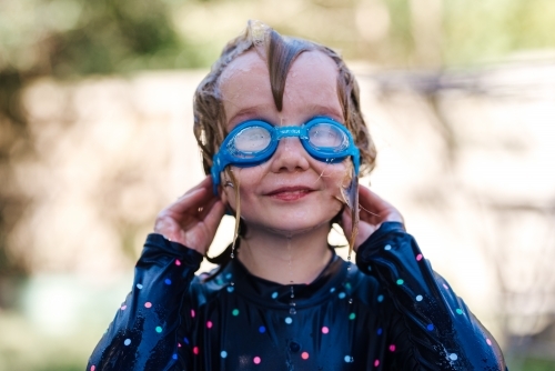 Girl in goggles, water play