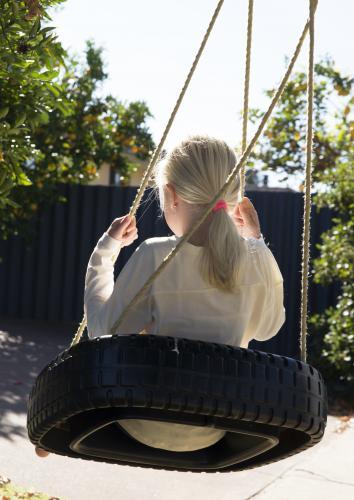 Girl on swing - Australian Stock Image