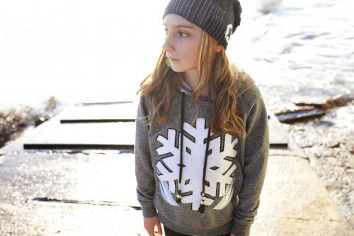 Girl standing on a boat ramp looking away to the side - Australian Stock Image