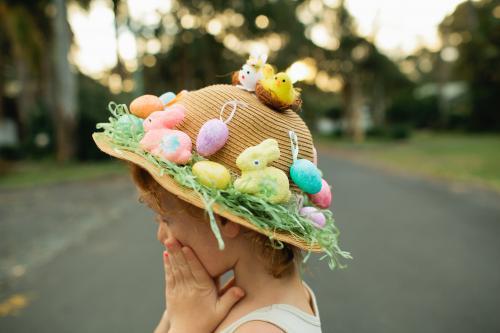 Girl wearing an Easter hat in the street