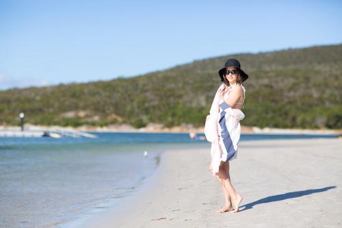 Girl wearing hat on beach at Emu Point - Australian Stock Image